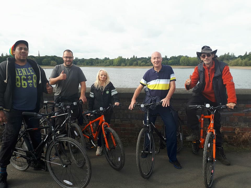 A group of DATUS service users on bicycles